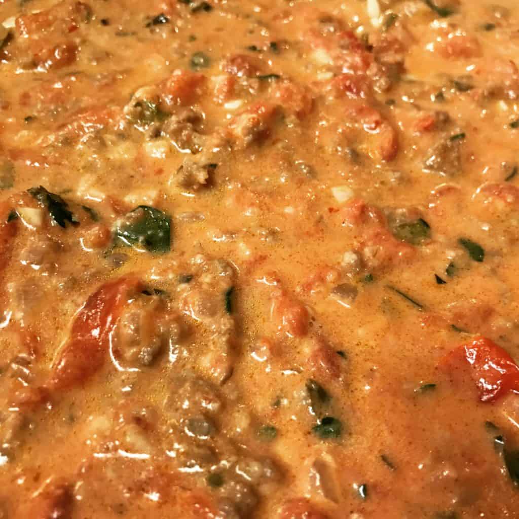 a pot of spicy sausage cream sauce
