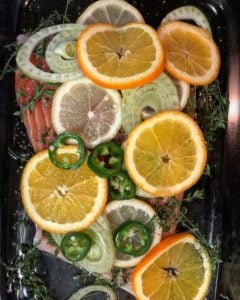 a glass casserole dish of olive oil salmon