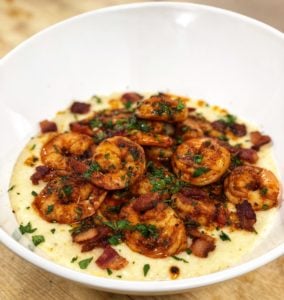 a bowl of shrimp and grits