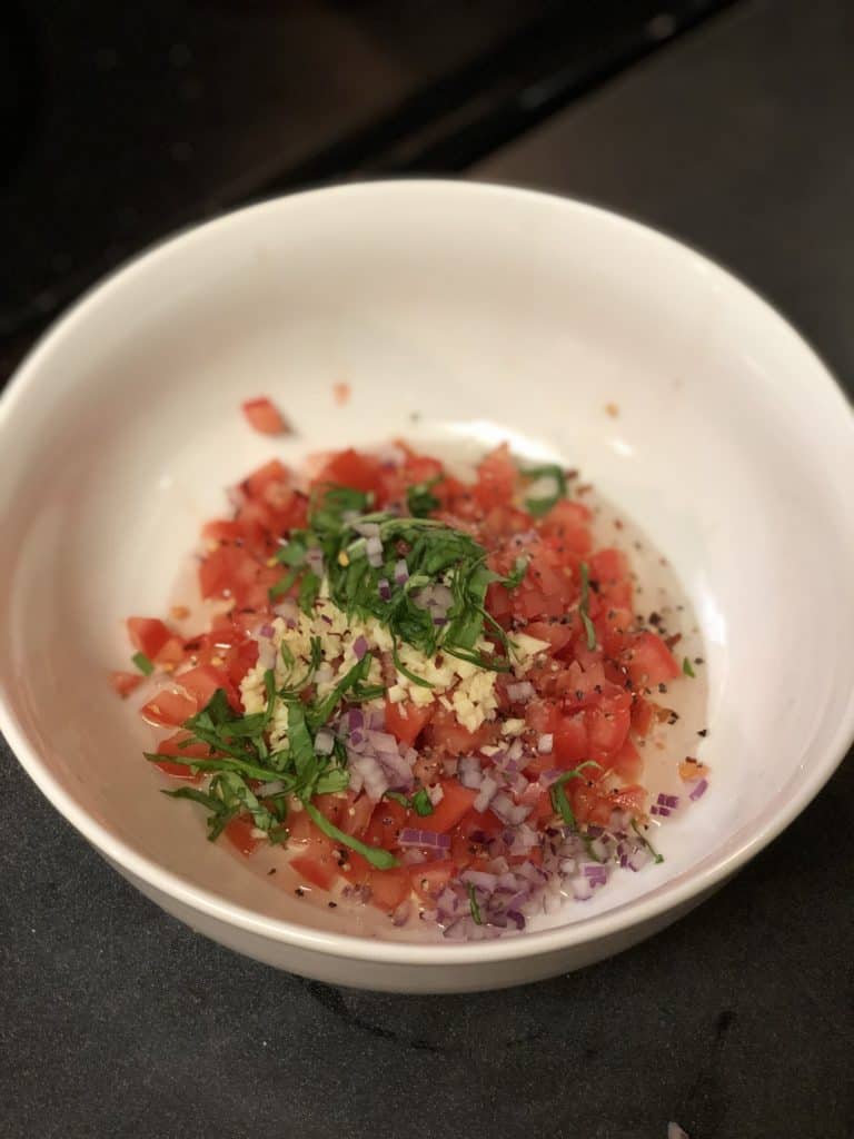 toppings in a white bowl for bruschetta