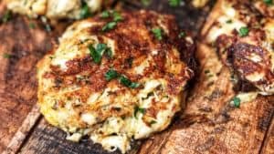 crab cakes displayed on a wooden board