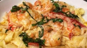 a bowl of shrimp fettuccine