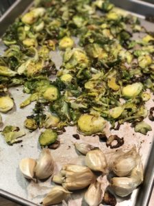 a pan of roasted Brussels sprouts and garlic