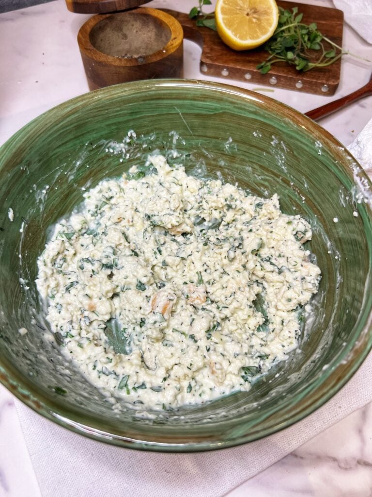 Filling for Clams Oreganata in a green bowl.