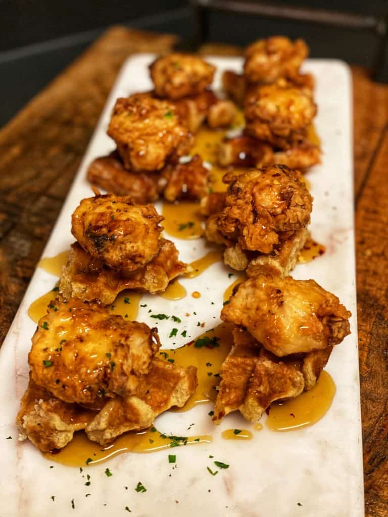 a plate of mini chicken and waffles for my super bowl party food blog