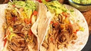 Chicken Tacos in a soft flour tortilla with homemade guacamole