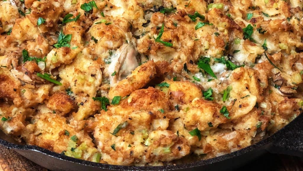 oyster dressing baked in a cast iron pan