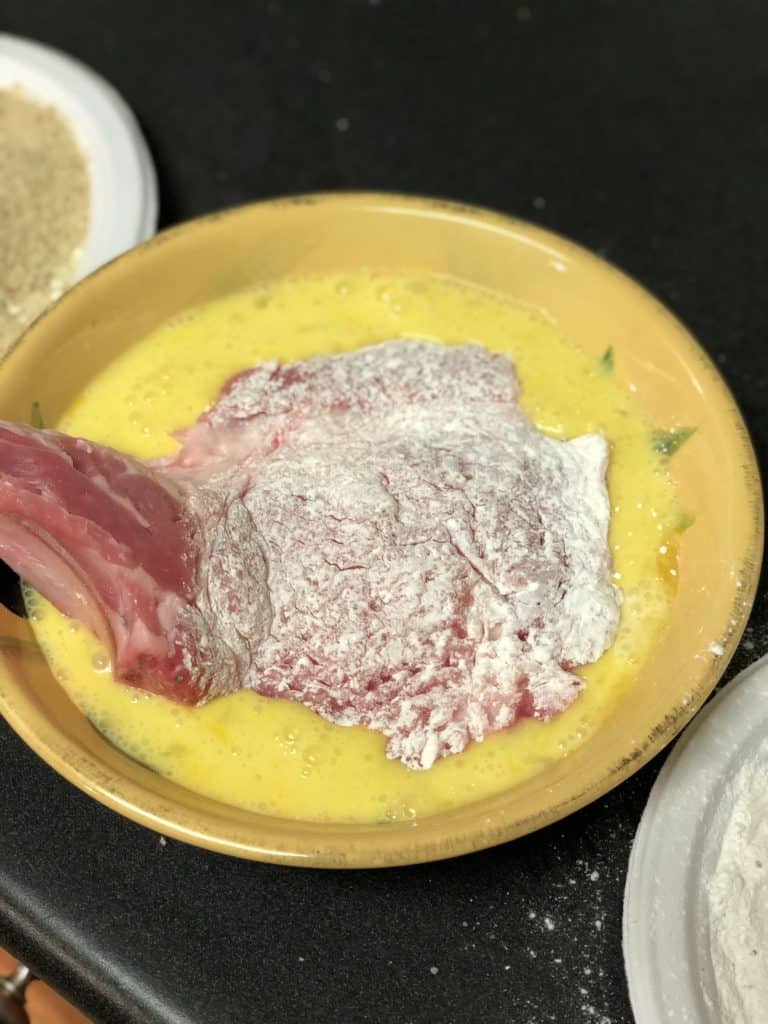 floured veal chop dipped in egg mixture