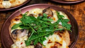 three mini mushroom pizzas