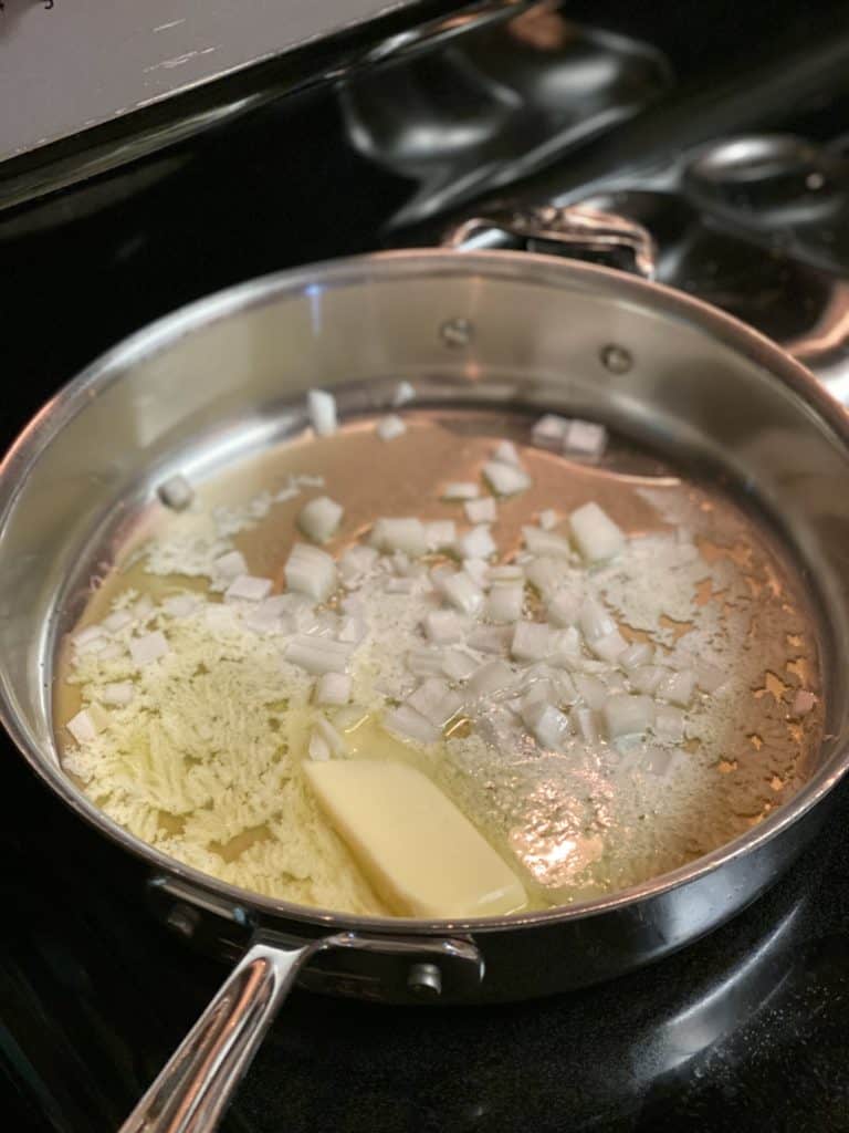 butter and onions browning in a skillet for pierogies