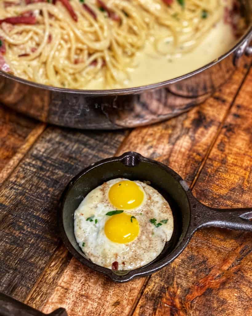 two fried quail eggs in a mini Lodge cast iron pan