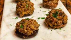 a plate of sausage stuffed mushrooms
