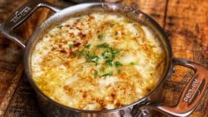 two mini pots of dauphinoise or scalloped potatoes