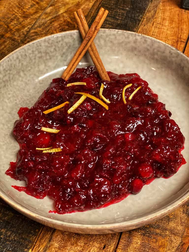 a bowl of homemade cranberry sauce for Thanksgiving dinner