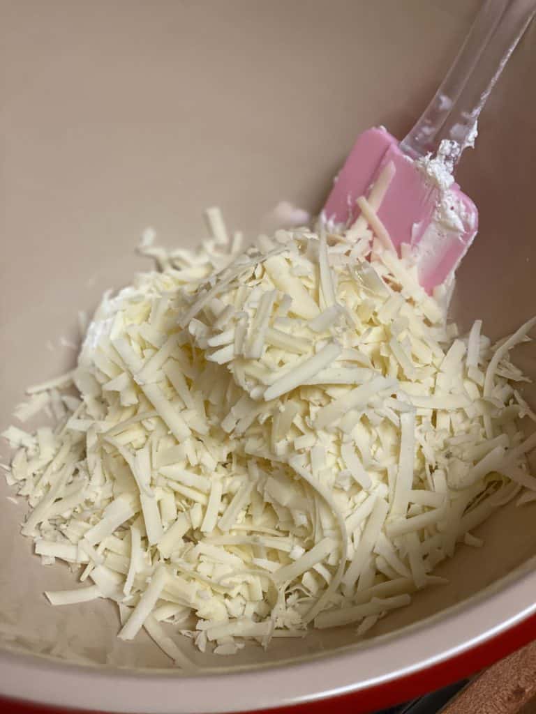 shredded cheddar cheese in a bowl