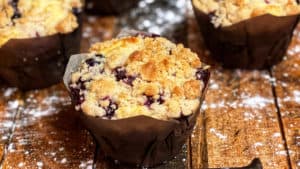 blueberry muffins on a wooden board