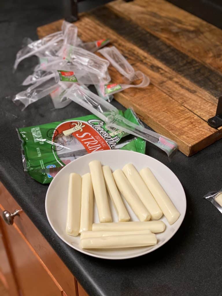 string cheese out of it's wrapper and in a bowl