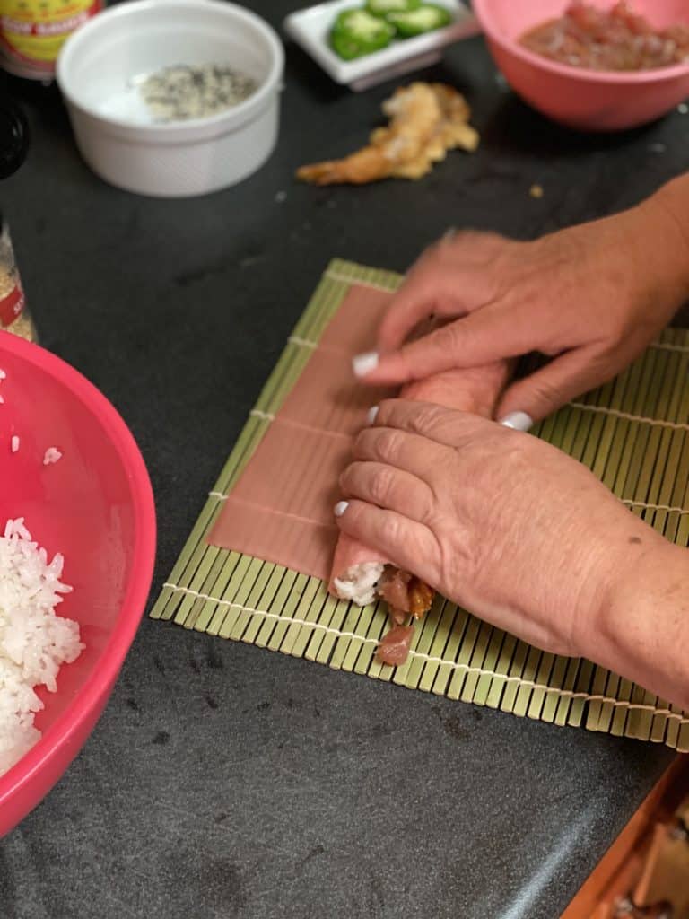 rolling sushi with a mat