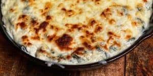 spinach artichoke dip in a cast iron pan