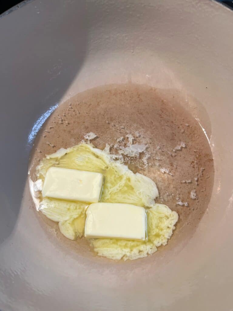 Oil and a stick of butter melted in a heavy bottom pot.