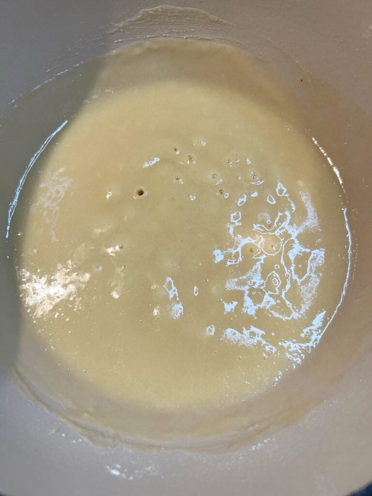Flour fully incorporated into butter and flour in a pot to make roux for New Orleans Style Gumbo.