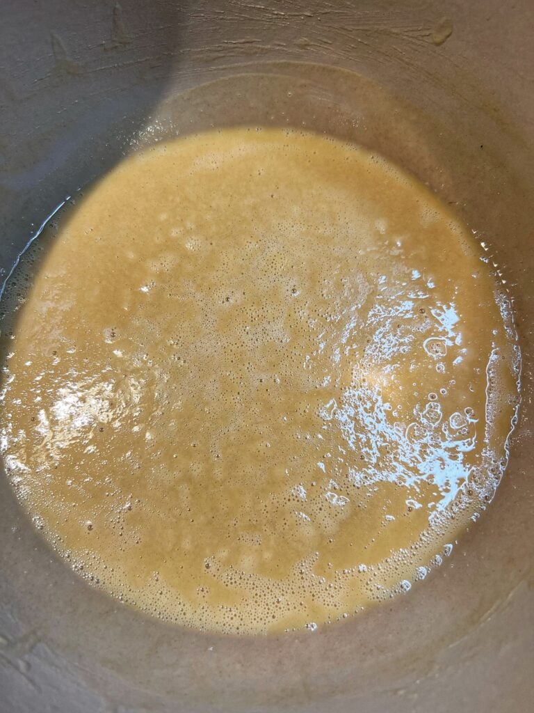 Roux after 20 minutes of cooking. The color has hues of brown.