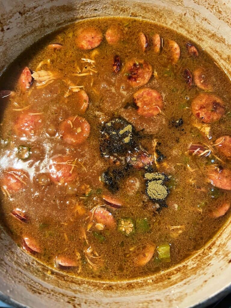 A teaspoon of gumbo file, it's a fine powder, add to a pot of simmered gumbo.