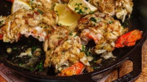 a cast iron pan of crab stuffed shrimp