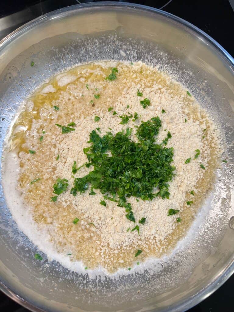 Plain breadcrumbs and chopped fresh parsley added to a white wine reduction with minced garlic and shallots.