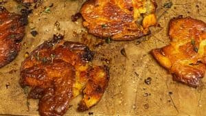 a sheet pan of crispy smashed red potatoes