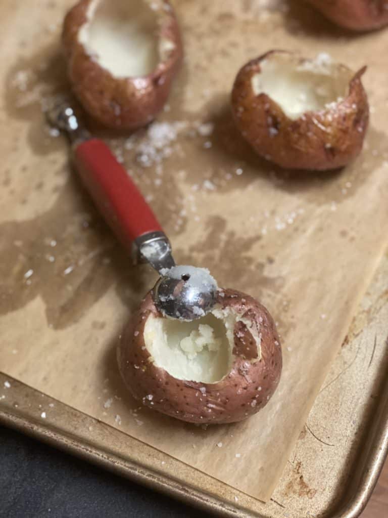 red potatoes with the insides scooped out with a melon baller