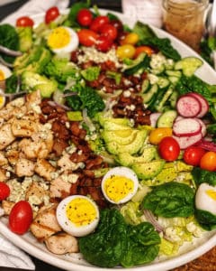 Cobb Salad with Vinaigrette on a white platter