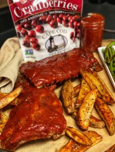 two racks of ribs with cranberry barbecue sauce