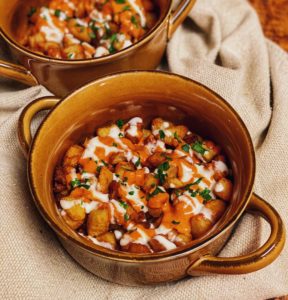 two crocks of patatas bravas