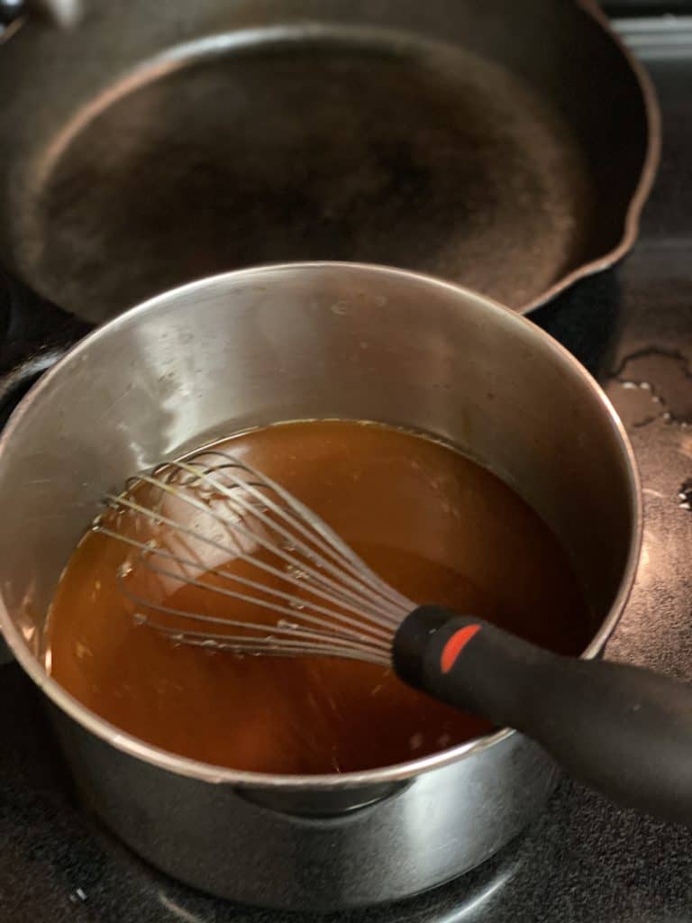 demi-glace and stock in a pot
