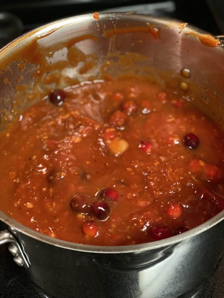 a pot of cranberry barbecue sauce for ribs