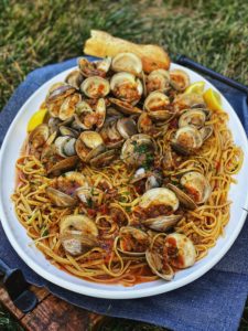 linguine with red clam sauce on a white platter
