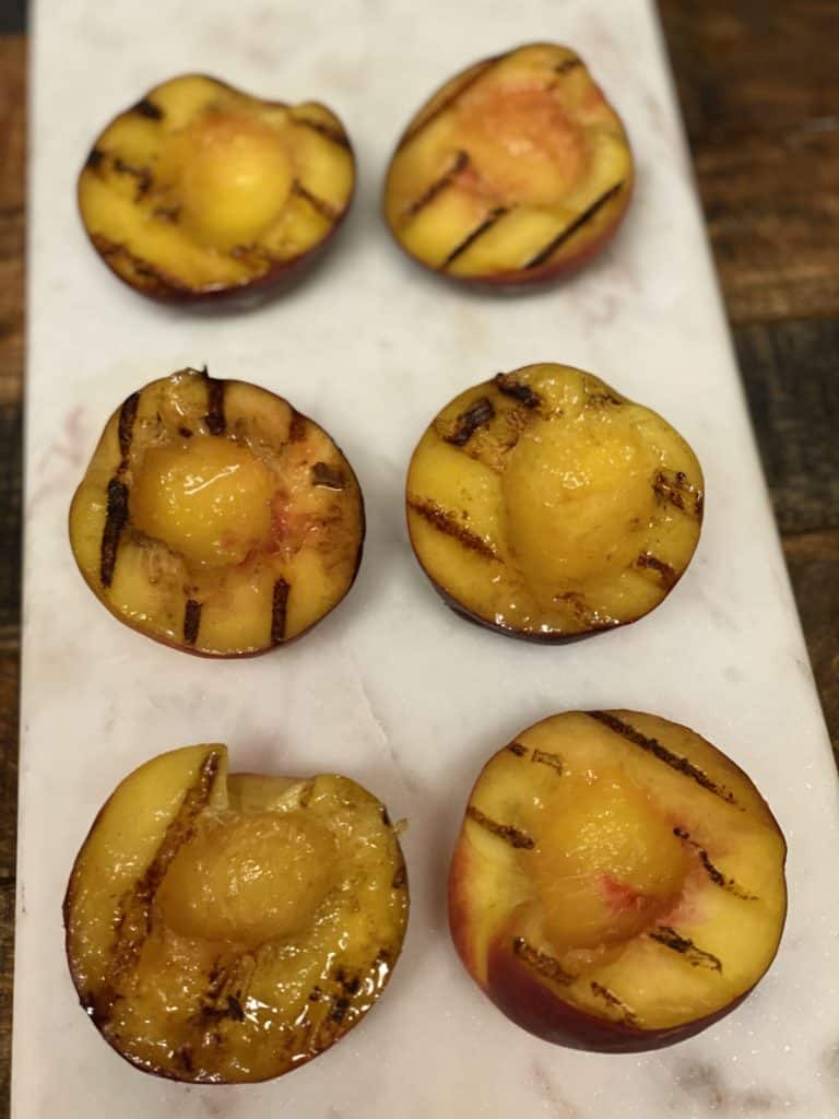 grilled peach halves ready for the apricot jam browned butter