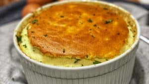 cheese soufflé in a white ramekin