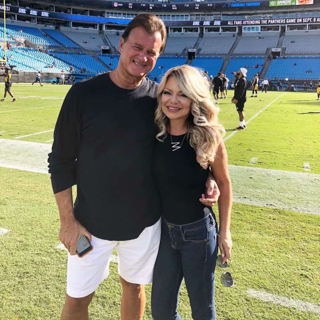 a photo of me and my husband on a football field