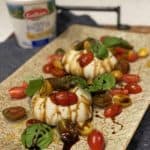 a platter of two pieces of homemade burrata salad