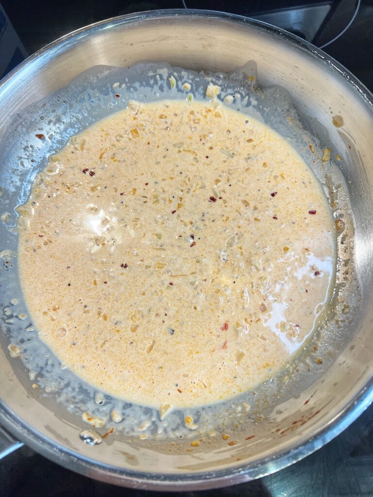 A tomato cream sauce in a pan.