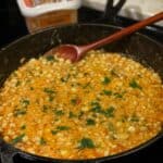 a cast iron pan full of Pimento Cheese Corn