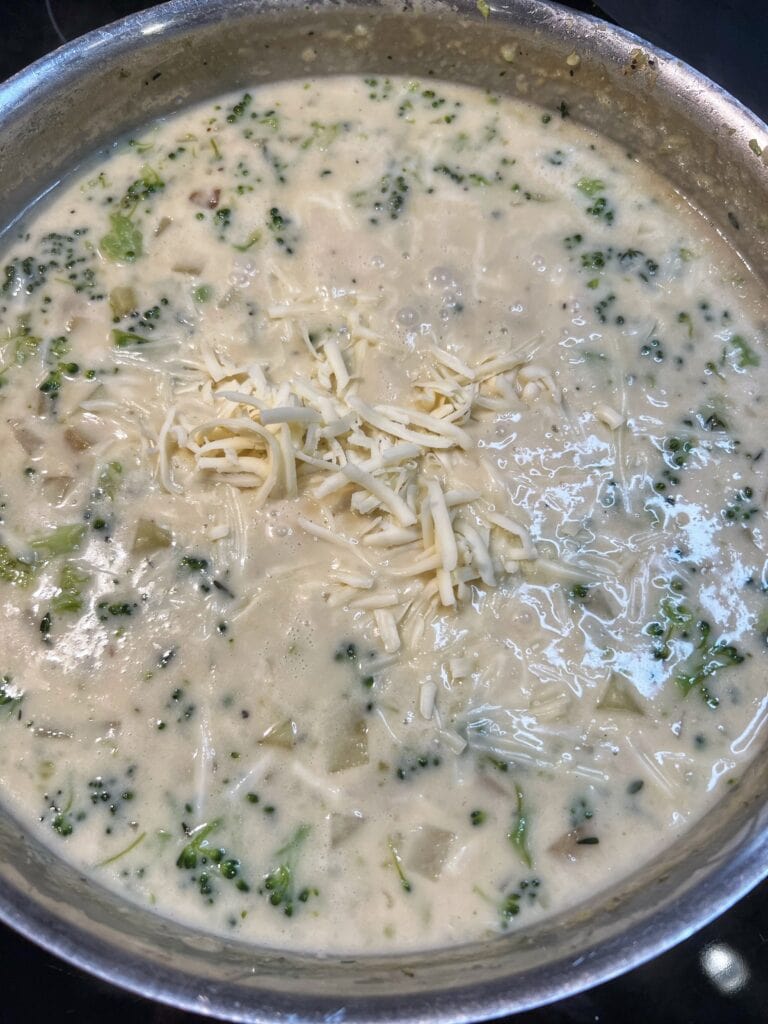 Shredded cheese added to a creamy base for pot pie.
