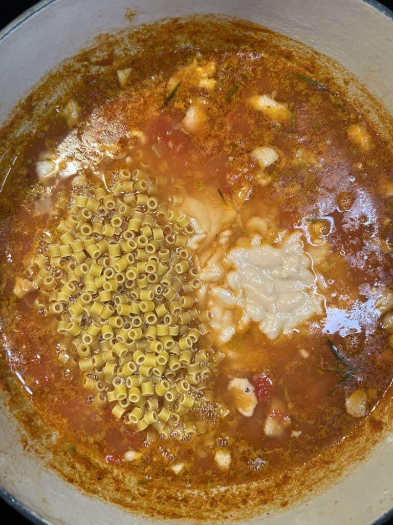 Ditalini pasta and blended beans added to the soup base for Pasta Fagioli
