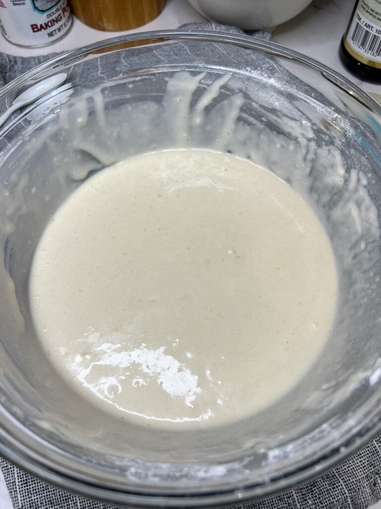 Pancake batter in a glass bowl.