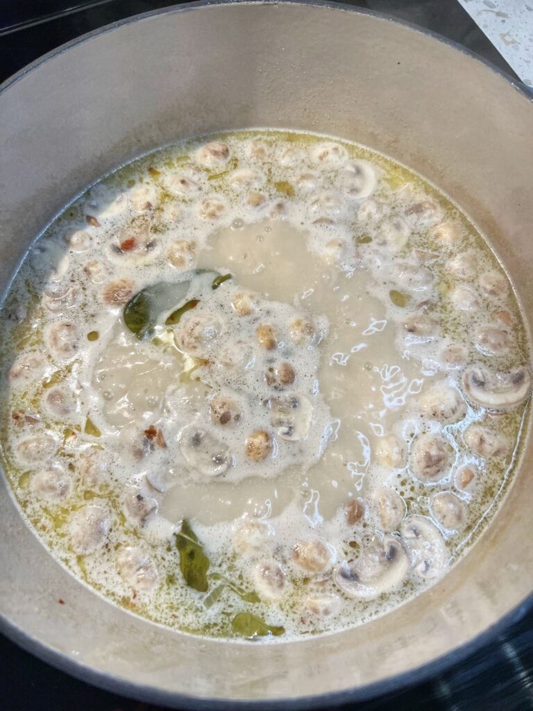 Mushrooms simmered in a coconut broth.