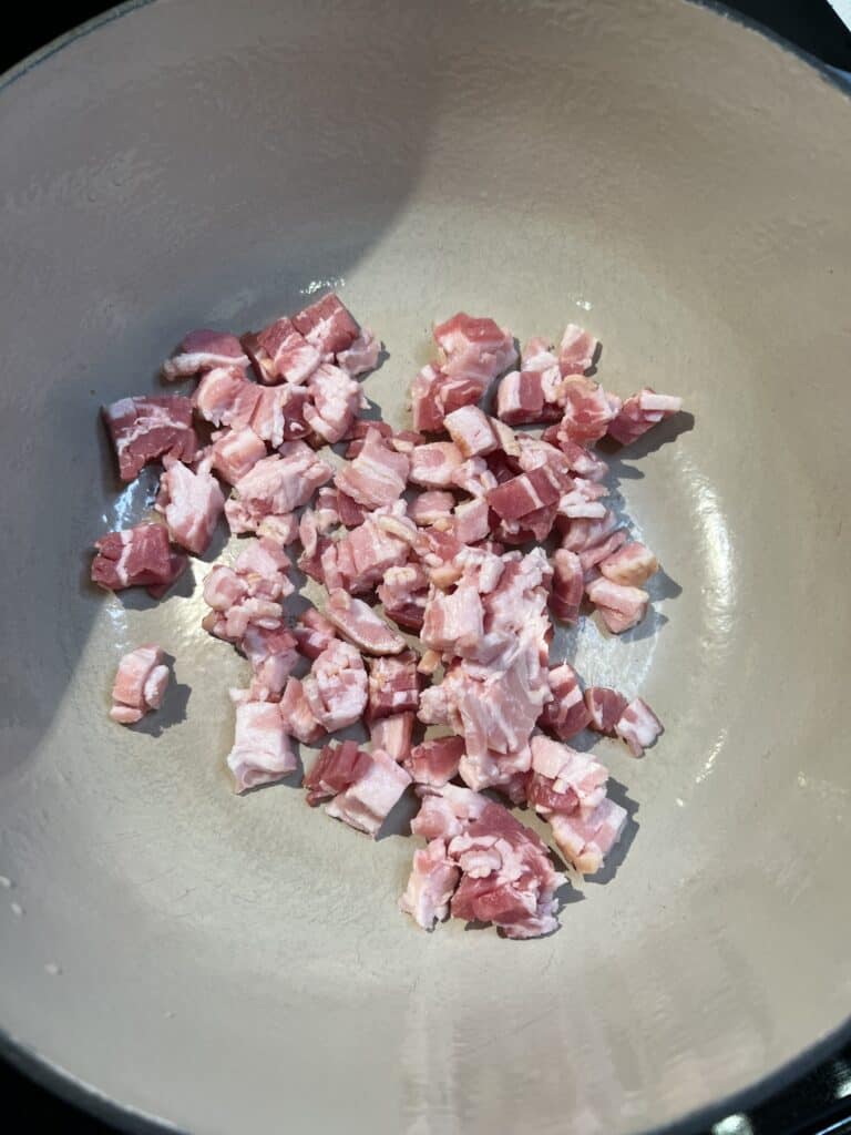 Diced bacon in a pot.