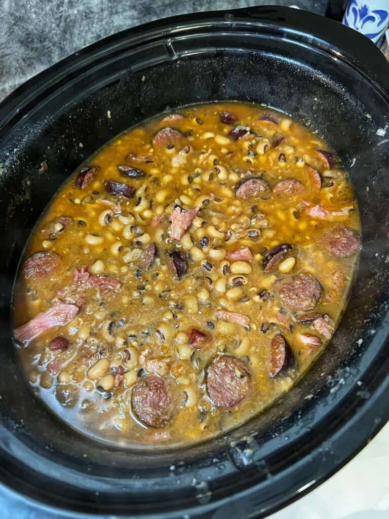 A crockpot full of finished black-eyed peas.