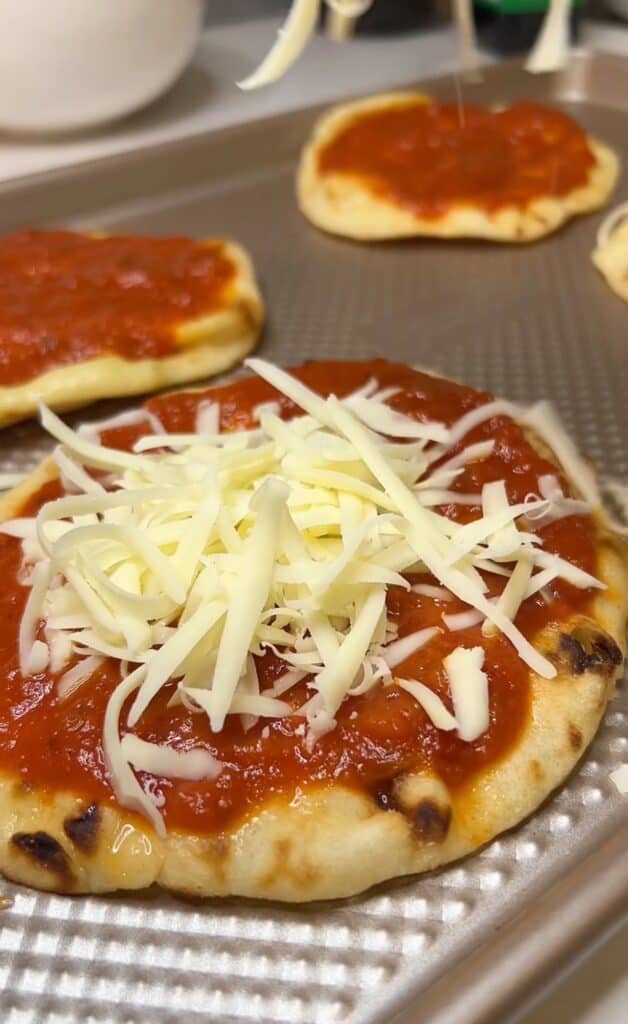 Naan topped with marinara sauce and shredded mozzarella.